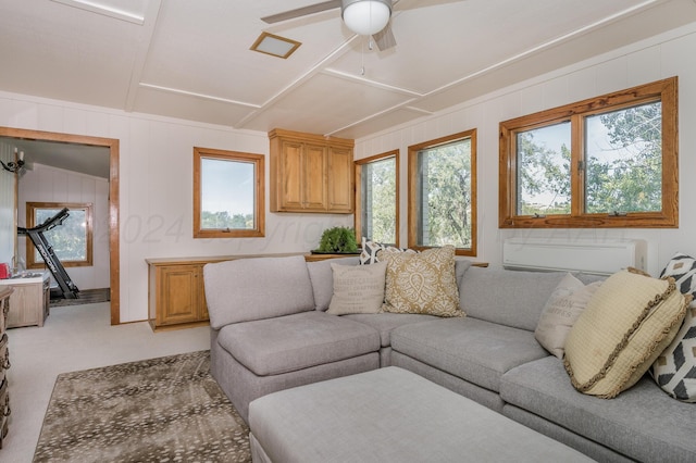 living room with a wealth of natural light, light colored carpet, and ceiling fan