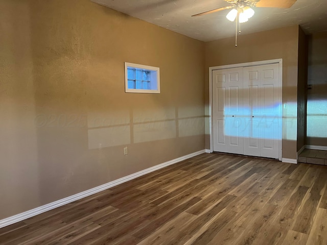 505 S Denton St, Booker, TX 79005 - unfurnished bedroom featuring wood finished floors and ceiling fan