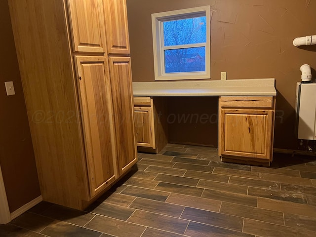 505 S Denton St, Booker, TX 79005 - unfurnished office featuring built in study area and wood finish floors