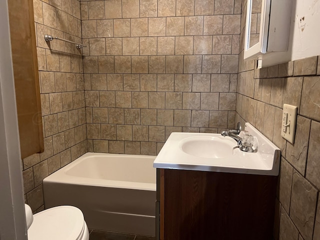 505 S Denton St, Booker, TX 79005 - bathroom featuring tile walls, vanity, and bathing tub / shower combination