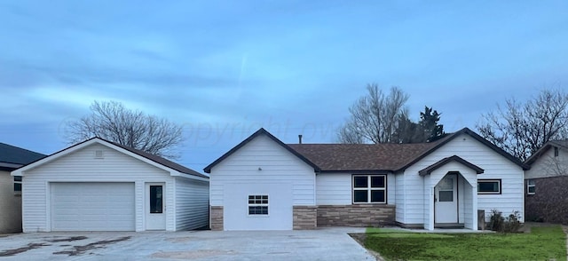 505 S Denton St, Booker, TX 79005 - ranch-style home with concrete driveway, a shingled roof, and stone siding