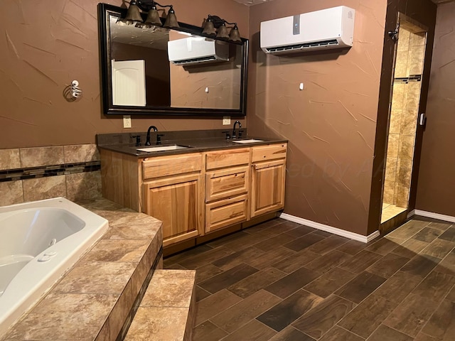 505 S Denton St, Booker, TX 79005 - bathroom featuring a wall mounted air conditioner, a tub with jets, double vanity, and a tile shower