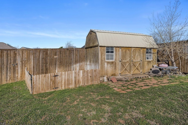 view of outdoor structure with an outbuilding and fence
