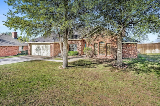 single story home with a garage, fence, a front lawn, brick siding, and driveway