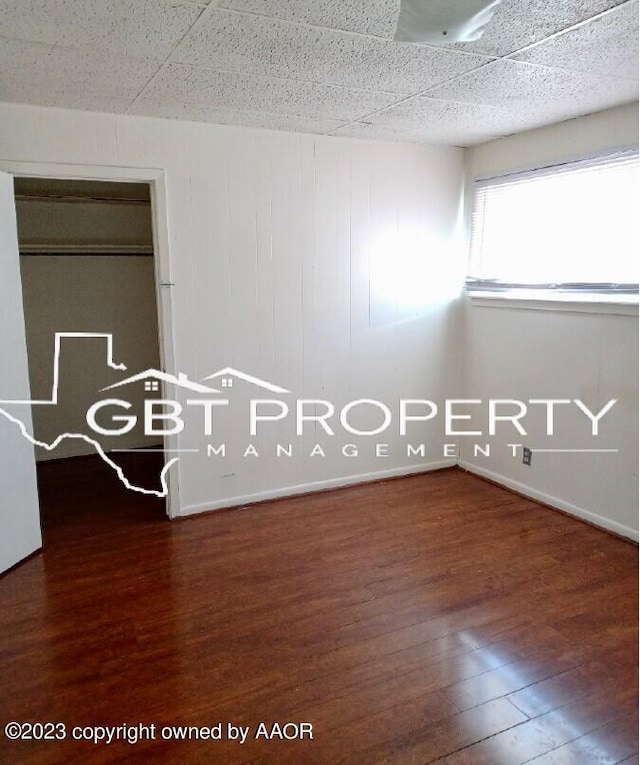 unfurnished room featuring dark hardwood / wood-style floors