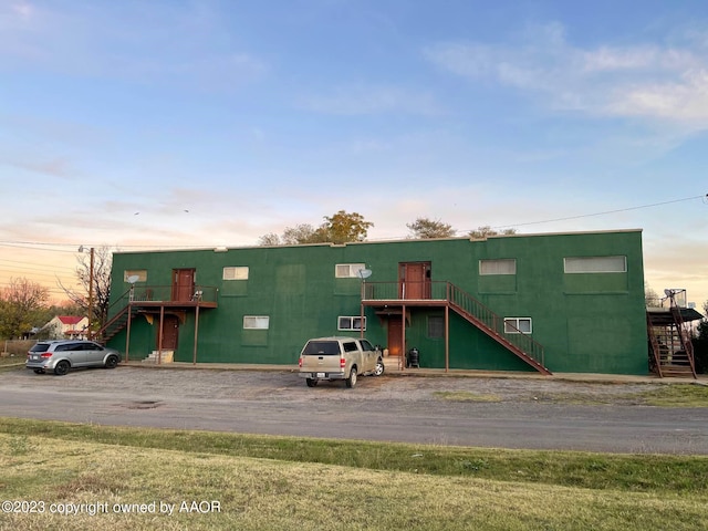 view of outdoor building at dusk