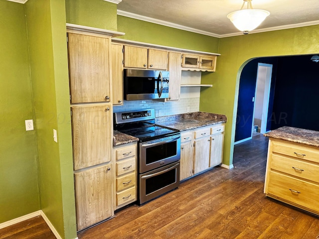 kitchen with stainless steel appliances, crown molding, backsplash, and dark hardwood / wood-style flooring