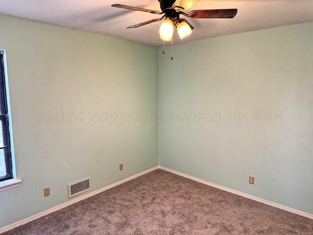 carpeted empty room featuring ceiling fan