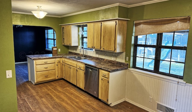 kitchen featuring sink, kitchen peninsula, ornamental molding, dark wood-type flooring, and dishwasher