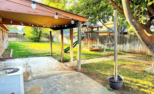 view of patio featuring a playground and cooling unit