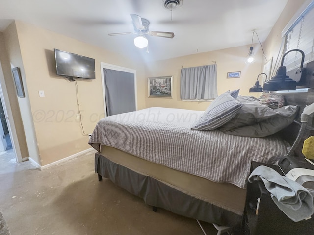 bedroom featuring visible vents, concrete floors, baseboards, and ceiling fan