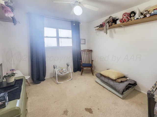 bedroom with carpet floors, a ceiling fan, and baseboards