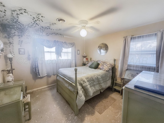 bedroom featuring ceiling fan, visible vents, and baseboards