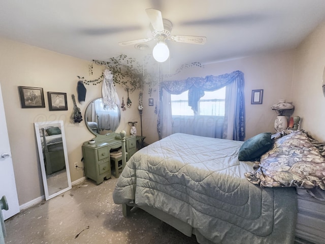 bedroom with ceiling fan, baseboards, and unfinished concrete flooring