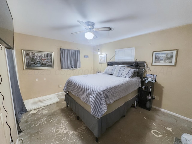 bedroom with concrete flooring, baseboards, and a ceiling fan