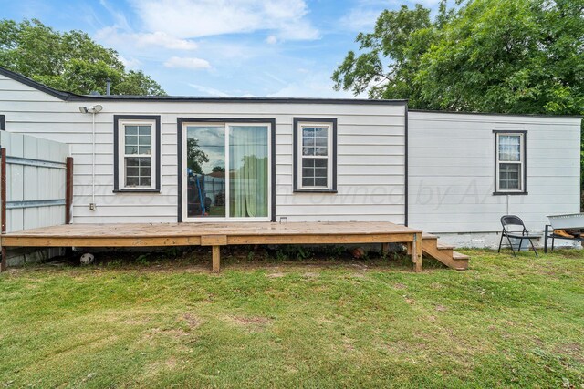 4102 SE 12th Ave, Amarillo, TX 79104 - rear view of property featuring a lawn and a wooden deck
