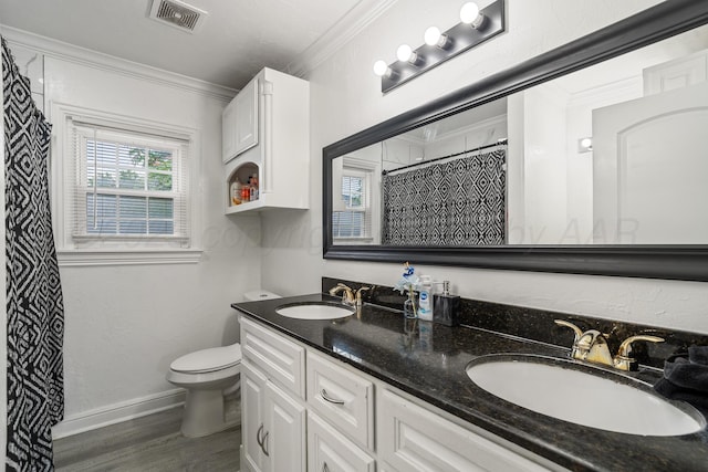 4102 SE 12th Ave, Amarillo, TX 79104 - bathroom featuring double vanity, crown molding, wood finished floors, and curtained shower