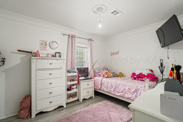 4102 SE 12th Ave, Amarillo, TX 79104 - bedroom with ornamental molding and wood finished floors