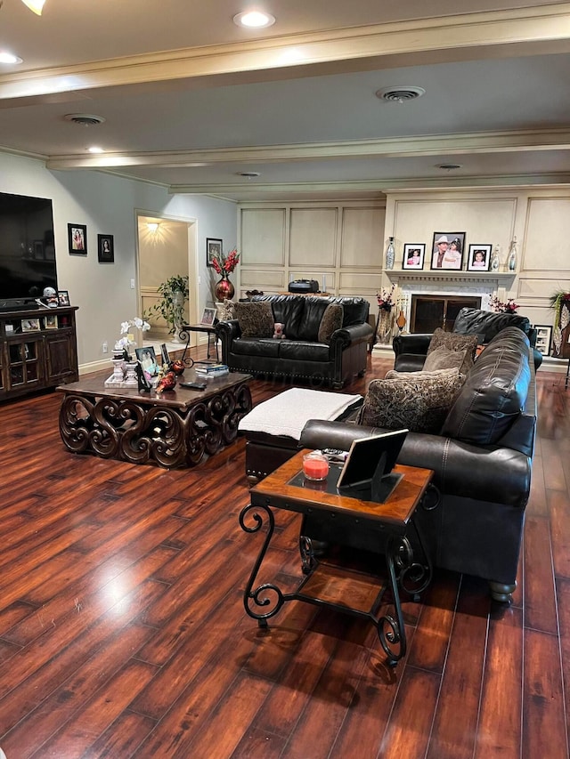 living room featuring crown molding and dark wood-type flooring