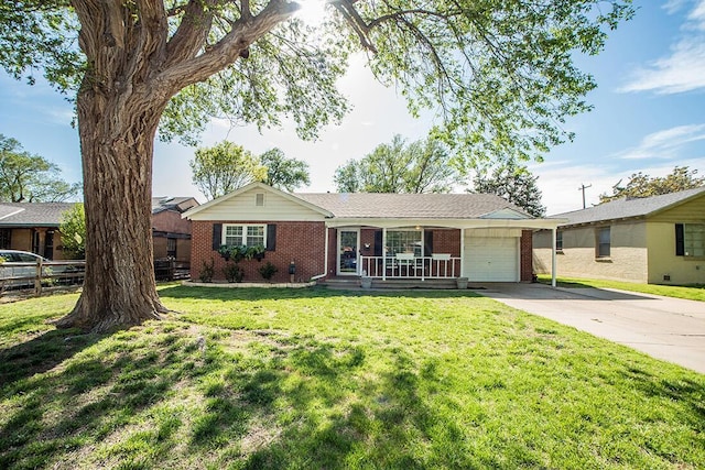 ranch-style home with fence, a front lawn, brick siding, a garage, and concrete driveway