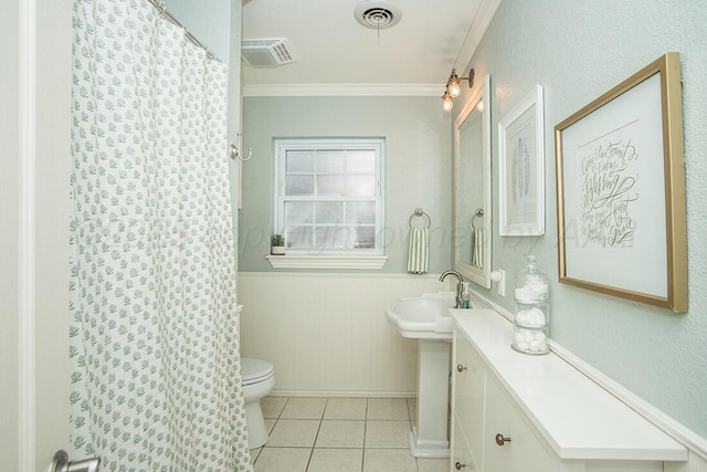 bathroom with crown molding, tile patterned flooring, visible vents, and toilet