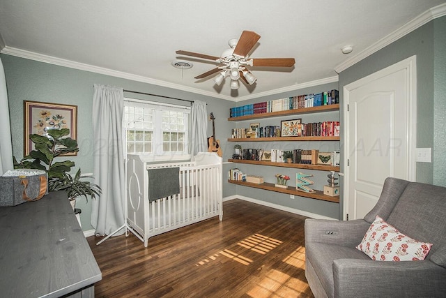 bedroom with baseboards, ornamental molding, ceiling fan, and dark wood-type flooring
