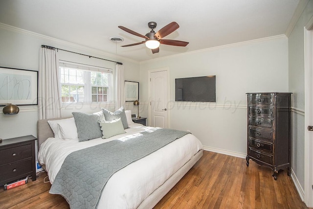 bedroom featuring crown molding and wood finished floors