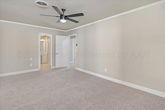 unfurnished bedroom with light colored carpet, crown molding, visible vents, baseboards, and connected bathroom