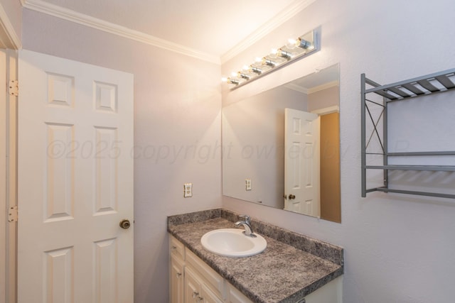 bathroom with crown molding and vanity