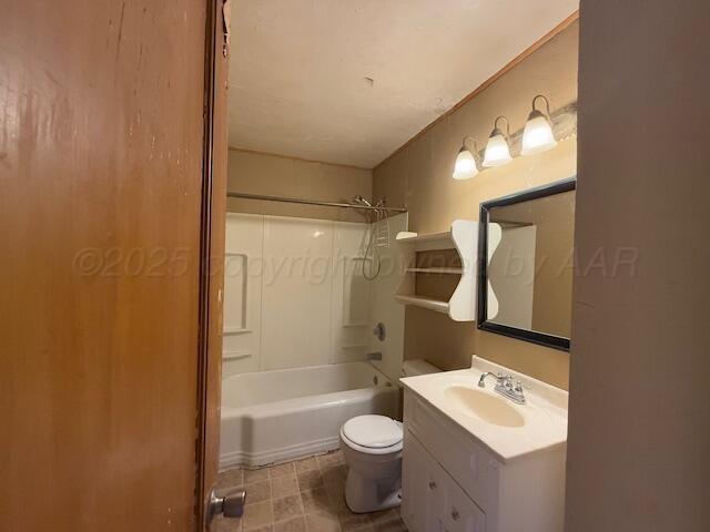 full bathroom featuring shower / washtub combination, toilet, and vanity