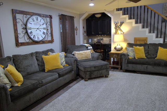 living room featuring ornamental molding and dark hardwood / wood-style flooring