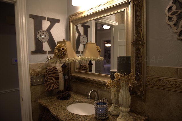 bathroom featuring tile walls and vanity