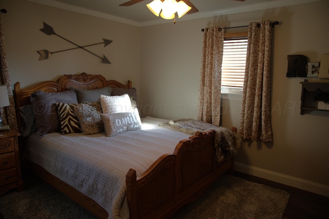 bedroom featuring ceiling fan and ornamental molding