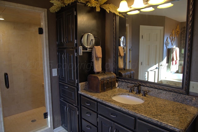 bathroom with vanity and walk in shower