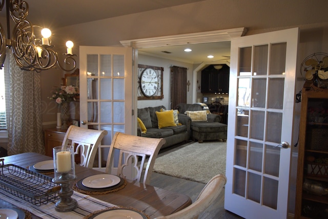 dining room featuring hardwood / wood-style floors and a chandelier