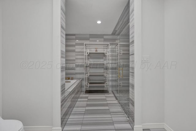 2411 S Lipscomb St, Amarillo, TX 79109 - bathroom featuring toilet, baseboards, recessed lighting, tiled bath, and tile patterned floors