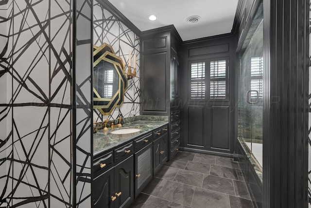 2411 S Lipscomb St, Amarillo, TX 79109 - full bath with vanity, a decorative wall, recessed lighting, and stone finish flooring
