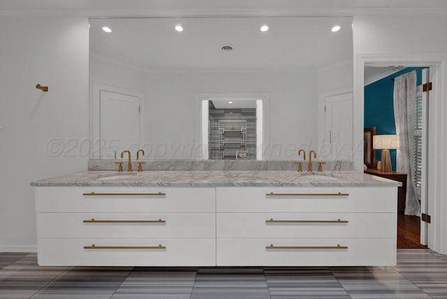 2411 S Lipscomb St, Amarillo, TX 79109 - full bath featuring double vanity, ornamental molding, and recessed lighting