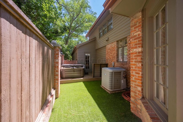 2411 S Lipscomb St, Amarillo, TX 79109 - view of yard with central AC and a hot tub
