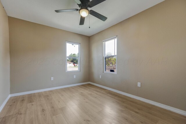 234 N Birge Ave, Dumas, TX 79029 - unfurnished room featuring light wood-style flooring, baseboards, and ceiling fan