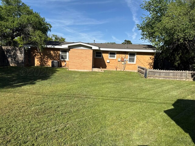 1902 Rogers St, Amarillo, TX 79106 - rear view of house featuring brick siding and central AC unit