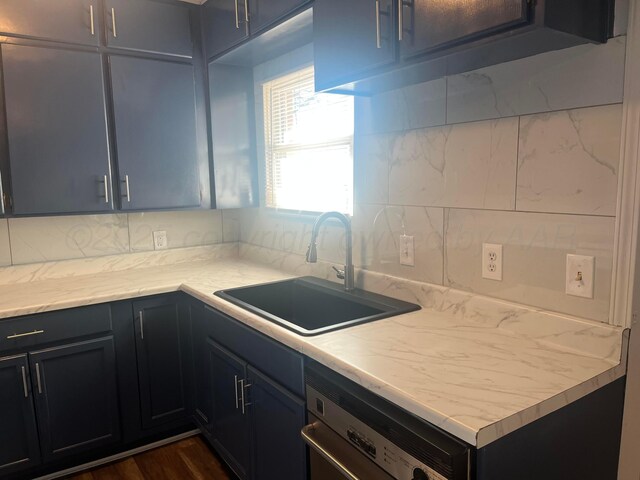 1902 Rogers St, Amarillo, TX 79106 - kitchen with a sink, dishwashing machine, backsplash, and light countertops