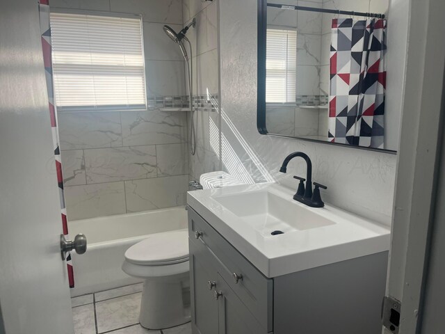 1902 Rogers St, Amarillo, TX 79106 - full bath with vanity, shower / bath combo with shower curtain, plenty of natural light, and toilet