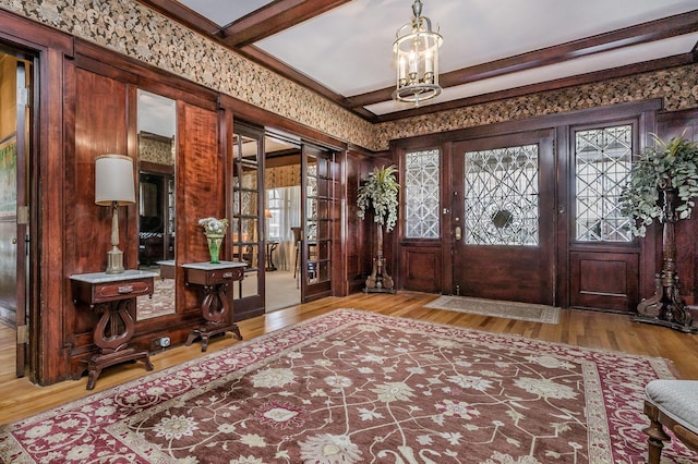 1620 S Tyler St, Amarillo, TX 79102 - entryway with wood finished floors, a chandelier, and beam ceiling