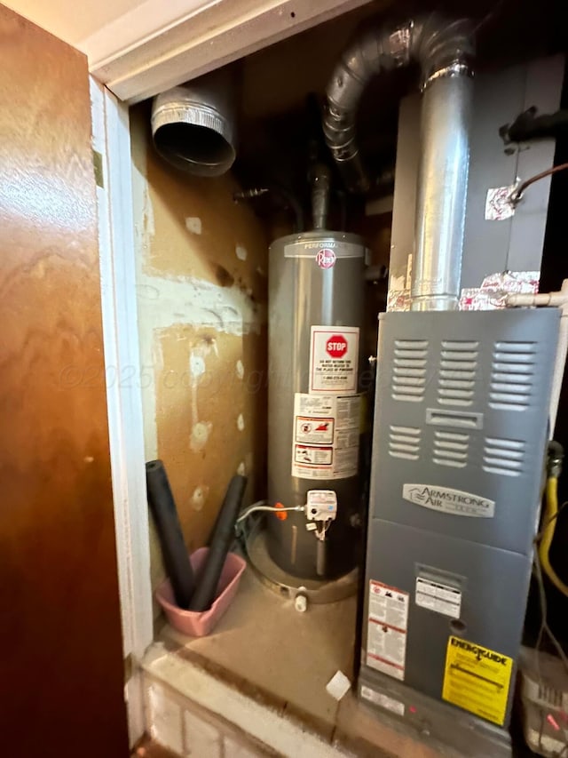 utility room with water heater and heating unit