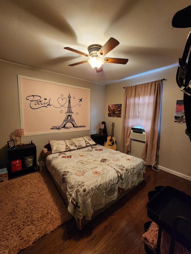 bedroom with baseboards, ceiling fan, and wood finished floors