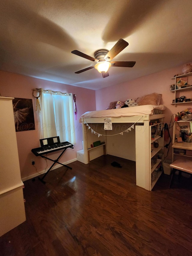 bedroom with ceiling fan and dark wood-type flooring