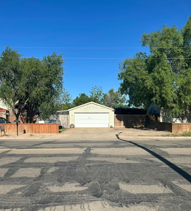 1026 S Eastern St, Amarillo, TX 79104 - view of front of property with fence, an attached garage, and concrete driveway