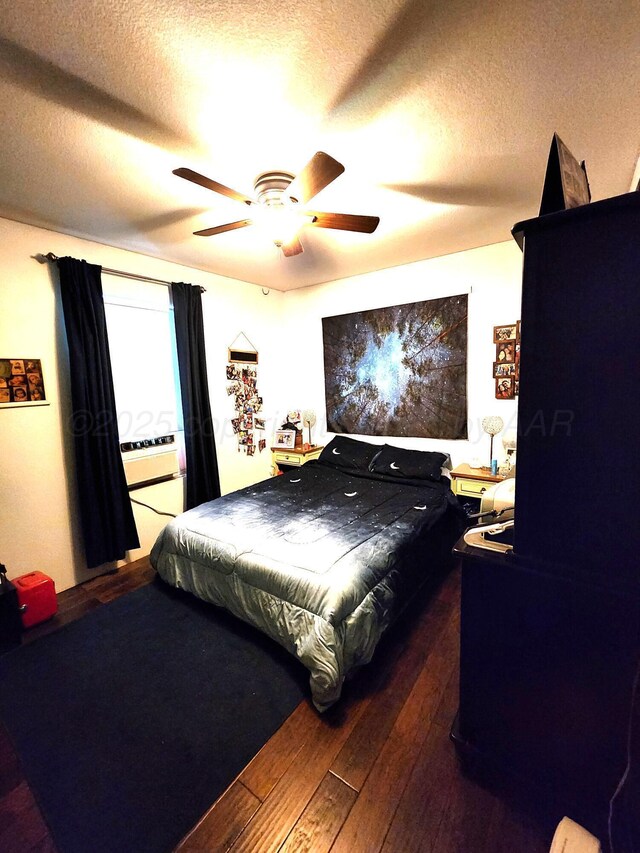 1026 S Eastern St, Amarillo, TX 79104 - bedroom with wood-type flooring, a textured ceiling, and ceiling fan