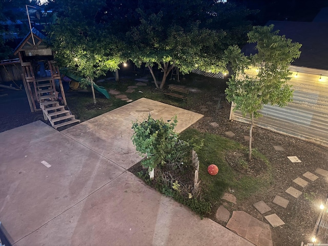 1026 S Eastern St, Amarillo, TX 79104 - yard at night with a playground and a patio